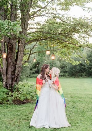 LGBTQ+ Brides Posing With Rainbow Pride Flag