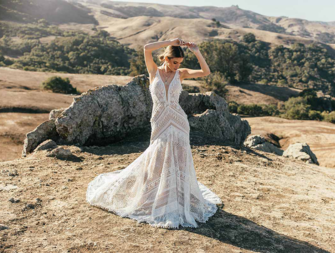 Lace boho gown with deep V neck and fringe and tassel details