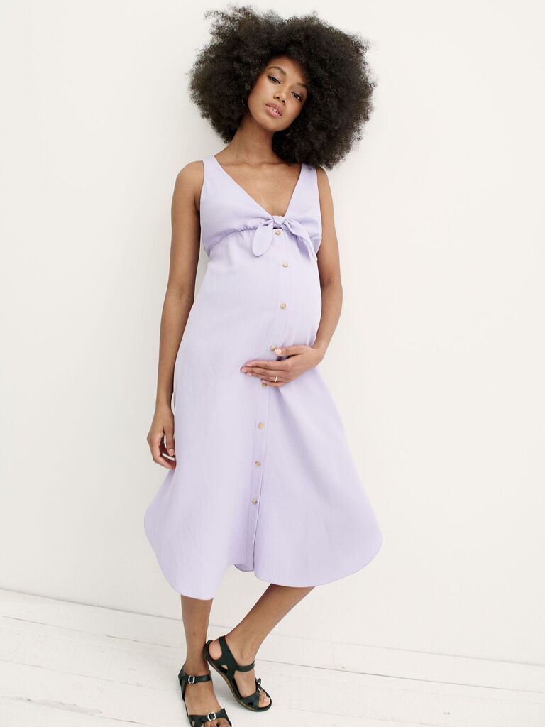 Model wears a lavender linen maternity dress. 