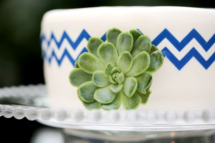 "We used small cakes on each table adorned with blue chevrons and accented with a succulents as our centerpieces," Courtney says. Each cake, made by Salt City Bakery in Utah, was set on a lighted stand.