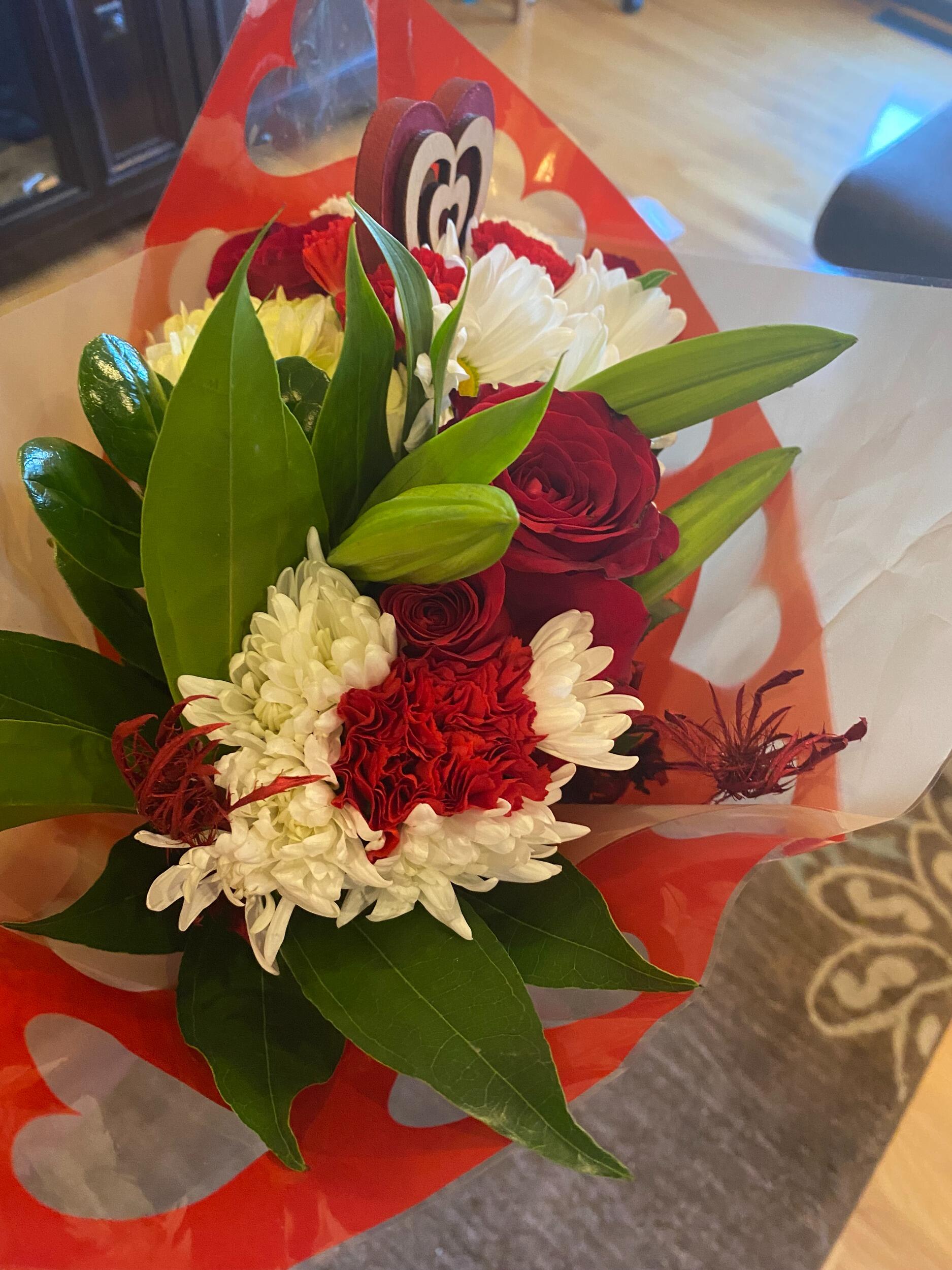 On Valentines day, Nick had sent me a bouquet of flowers with a cute heart in it. I had sent him flowers too. We both had decided to put them in vases on our dining tables. I was very excited about the flowers I received.