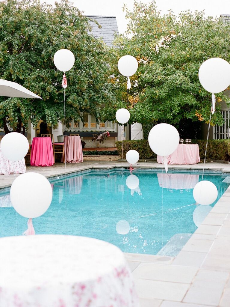 balloons floating above pool