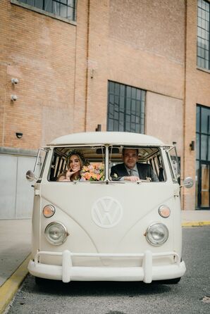 Couple Inside Volkswagen Bus During Retro Wedding