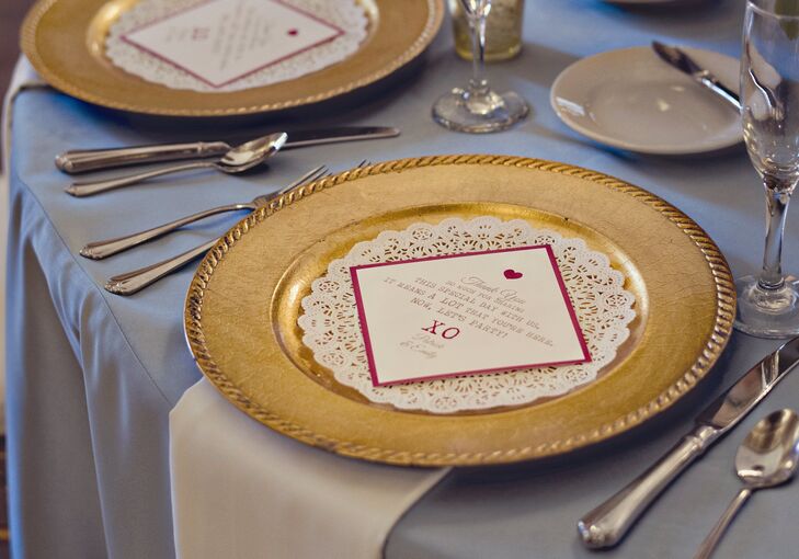 Lace doilies and personalized thank-you cards sat atop gold chargers on the guest tables.