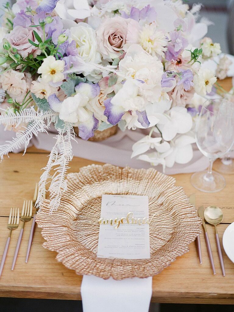 Pastel pink, purple and ivory flower centerpieces with rose gold accents at summer wedding