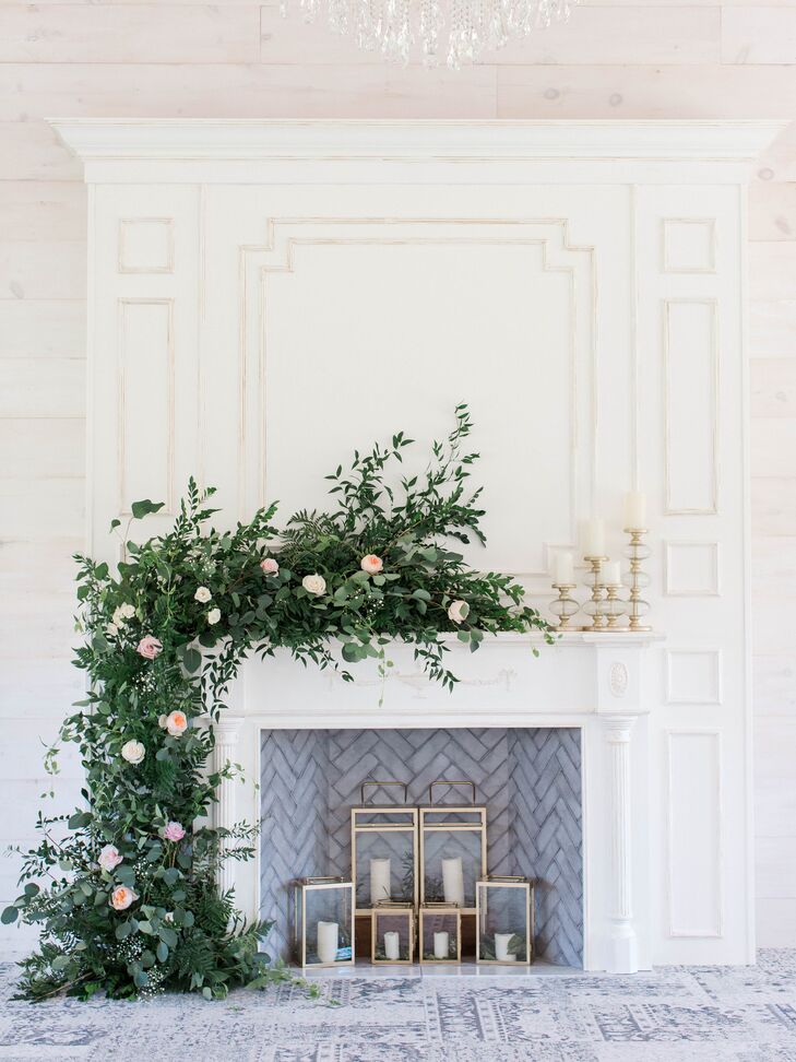 Romantic White Fireplace with Greenery and Candles