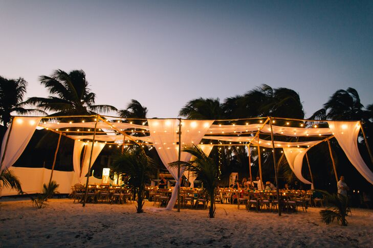 Draped Beach Reception With String Lights