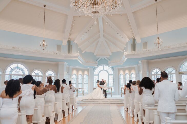 Bride in Ballgown and Groom on Tuxedo at Pavillion Ceremony Altar, Guests in White