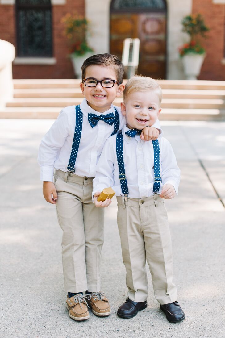 Matt's two nephews wore navy and white polka dot bow ties to serve as the couple's ring bearers. "They held hands walking down the aisle and carried a small pillow with faux rings," Anna says. "We didn't want to risk losing the real ones!"
