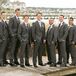Gray Tuxedo and Purple Tie Groomsmen Attire