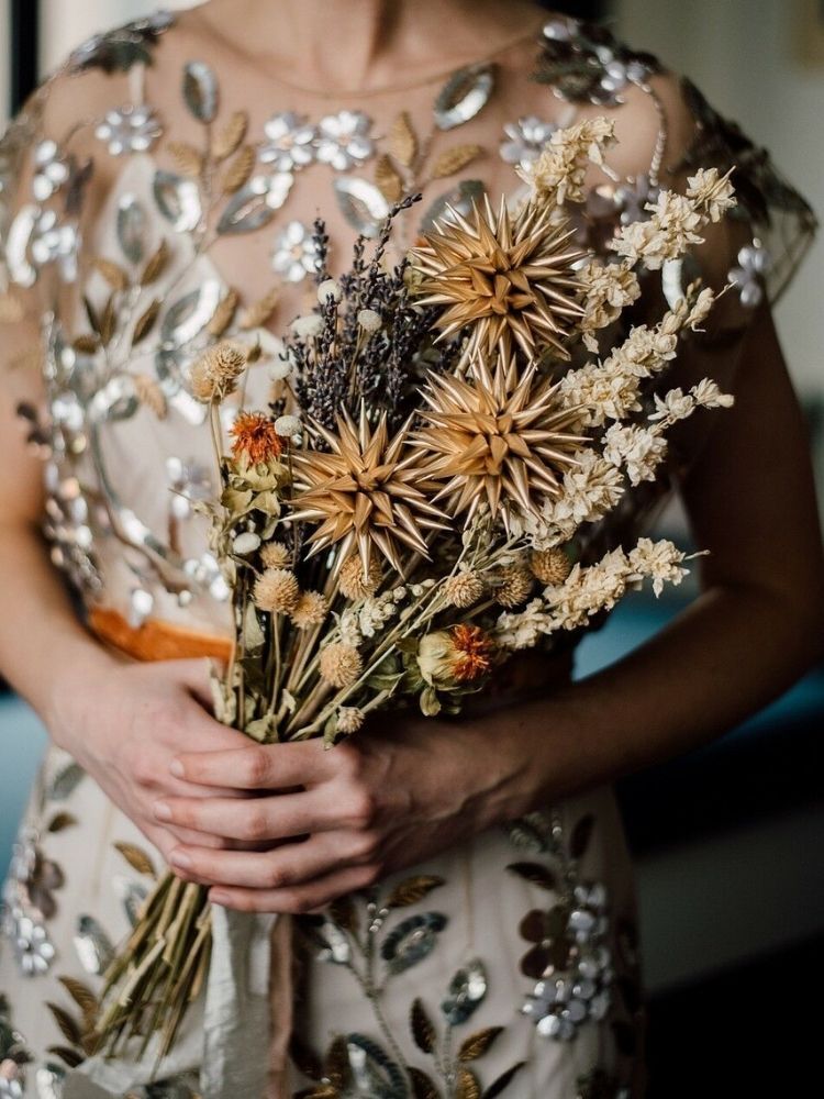 alternative wedding bouquet made with dried flowers and metal flowers