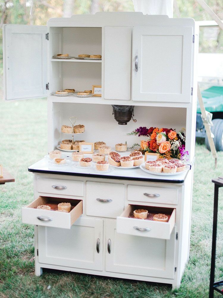 dessert buffet in vintage cabinet