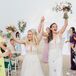 Brides Cheering During Recessional at Beach Ceremony at Bay Harbor Village Hotel in Petoskey, Michigan