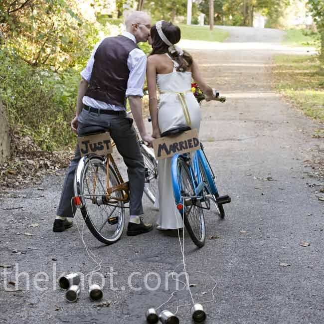 Jen and Jeff rode vintage bicycles with tin cans tied to the back wheels and cardboard signs that read, “just married.”