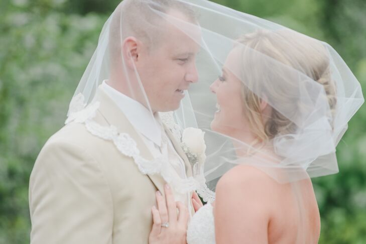 Couple Under Ivory Bridal Veil