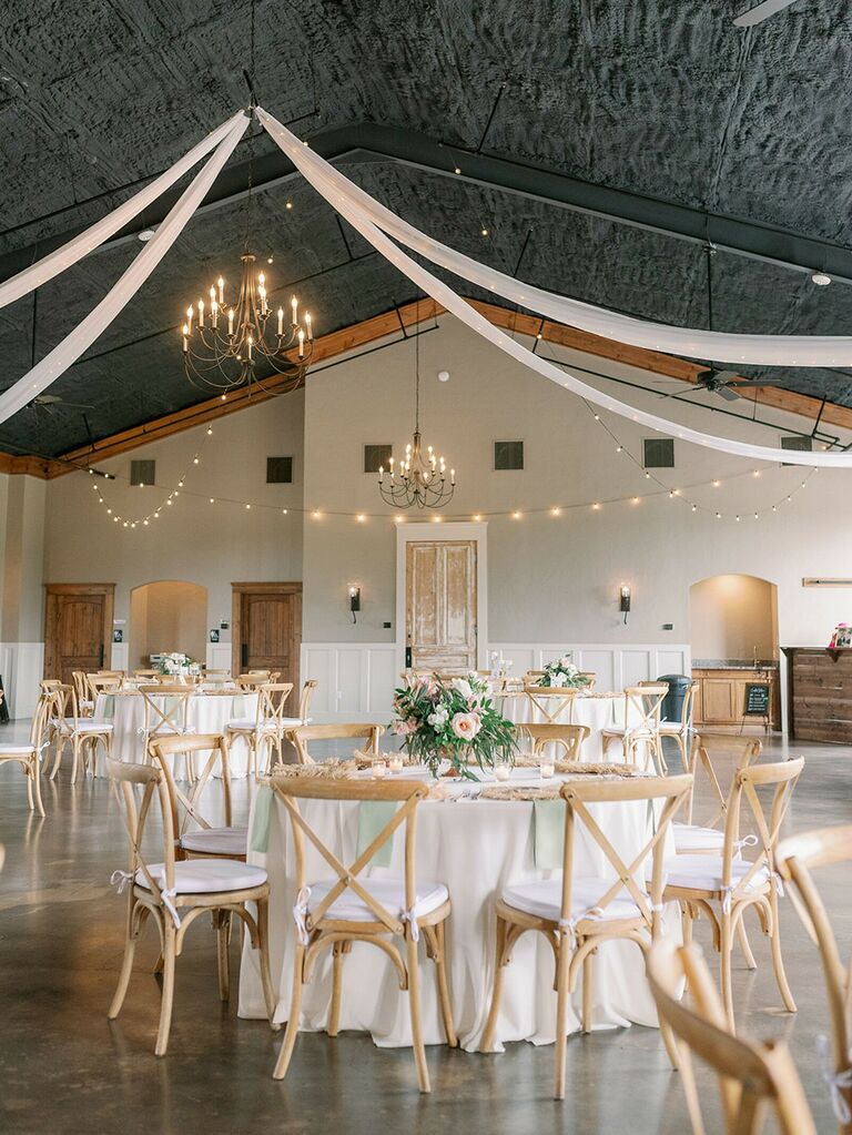 banquet hall wedding reception venue with white draping on ceiling