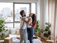 Couple embracing in new home with biophilic design