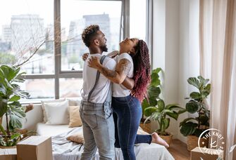 Couple embracing in new home with biophilic design
