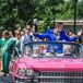 The Groom's Processional in Hot-Pink Cadillac