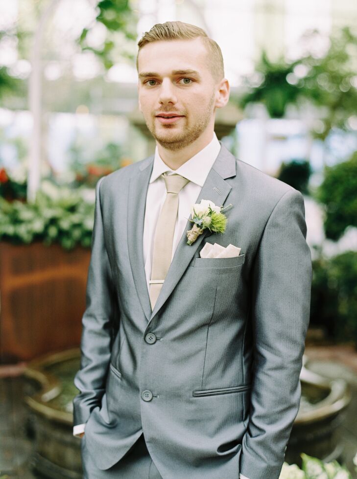Kyle wore a custom slick silver suit with a metallic gold tie to stand out in the garden.