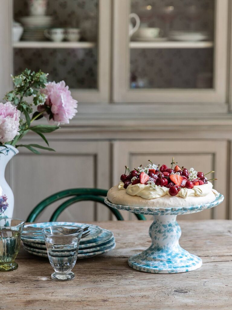 White and blue vintage pattern cake stand with pavlova on top