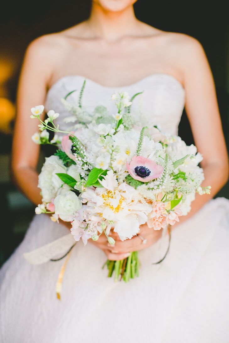 Patricia let florist Michelle Jacob take full control of all of the florals, requesting only that the flowers complement the venue and that anemones be included in the centerpieces and bouquets. However, the drought in California made finding anemones a difficult task. “Somehow my florist managed to find a vendor who was getting them imported,” says Patricia. “A week before our wedding we were told the anemones were destroyed at customs. I was devastated, since they’re my favorite flower, but two days before the wedding my wonderful florist was able to source the flowers! Anemones were limited, but we were able to incorporate them into all the bouquets, boutonnieres and a few centerpieces.”