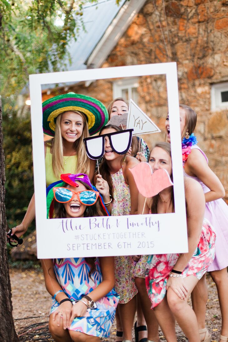 The couple had a handmade life-size photo frame made with their hashtag, #StuckeyTogether, hanging from a tree with costume items, so people could document their night.