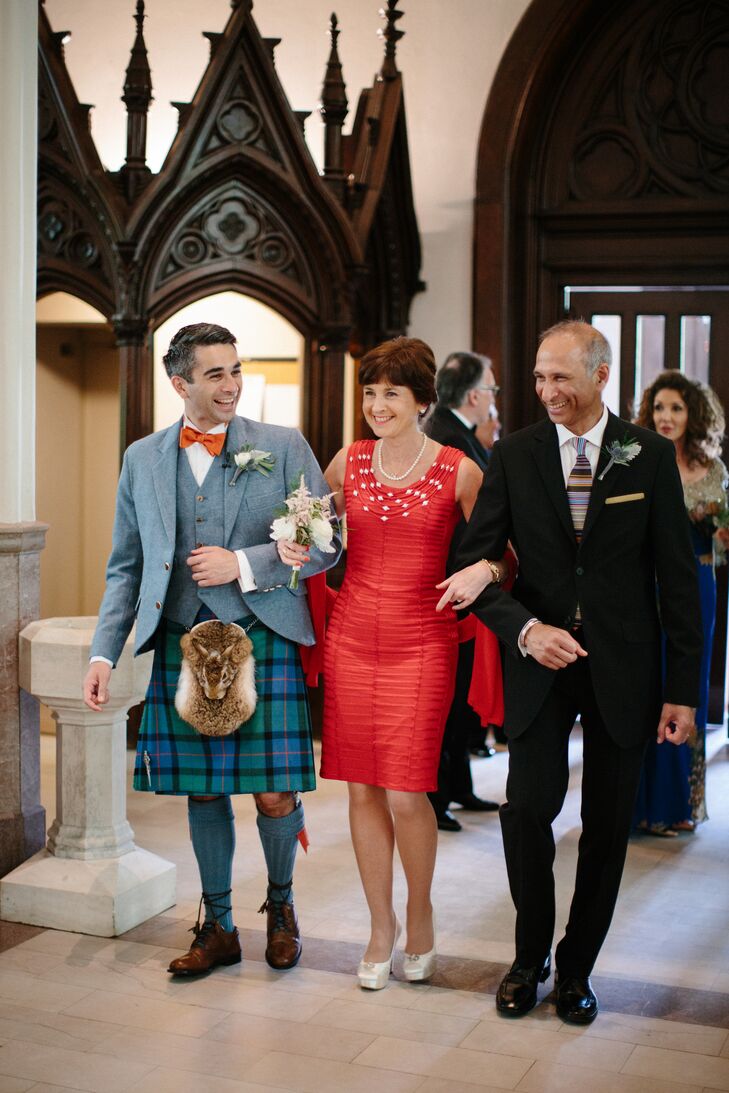 We loved Tristan's mother wore a knee-length red dress for the traditional wedding.