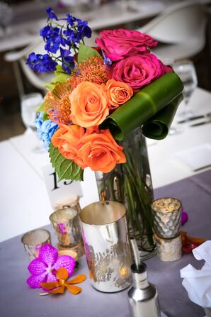 Bright Floral Centerpiece With Orange Roses and Proteas