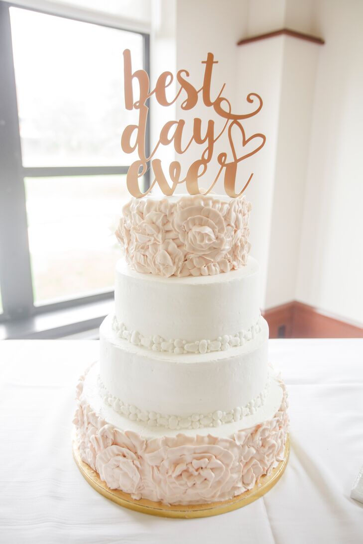 The four-tier blush and white wedding cake was decorated with a "Best Day Ever" topper that Tricia found on Etsy.