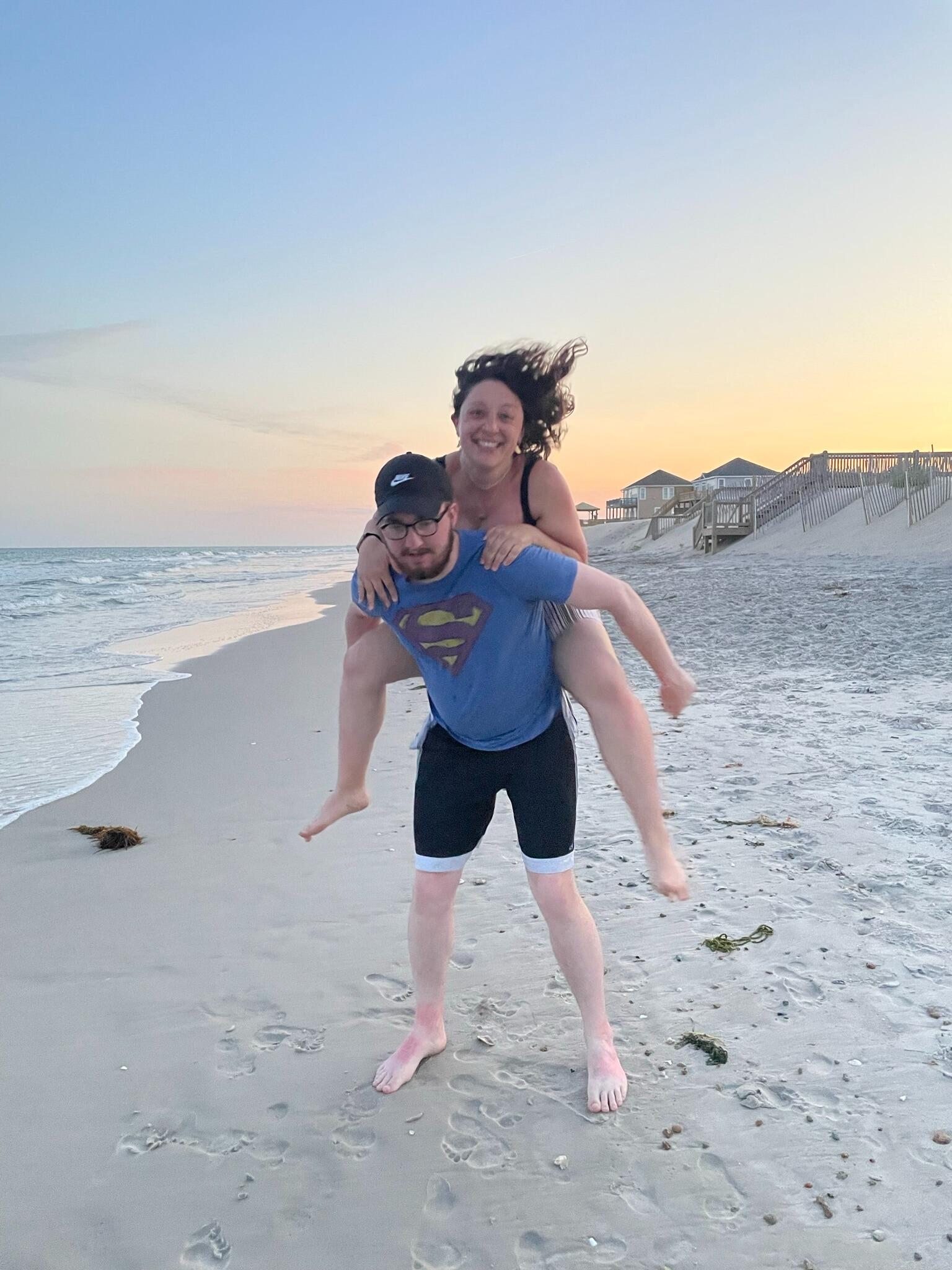 Straight back from the UK, Eva assaults Andrew and leaps onto his back.