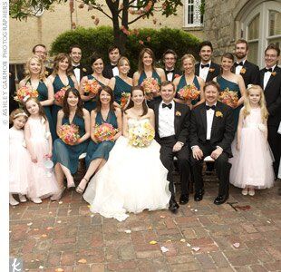 The bridesmaids chose between two styles in the same shade—one V-neck, the other one-shoulder—while the groomsmen wore classic tuxes and bow ties for a traditional, formal style.
