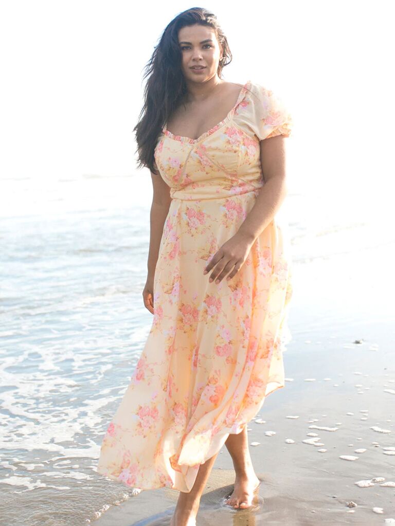 Ivy City Co. long floral wedding guest dress in yellow and pink print