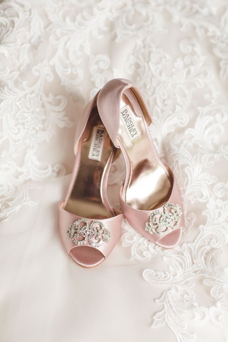 Tricia wore blush pink satin d'Orsay heels with a rhinestone toe detail from Badgley Mischka.