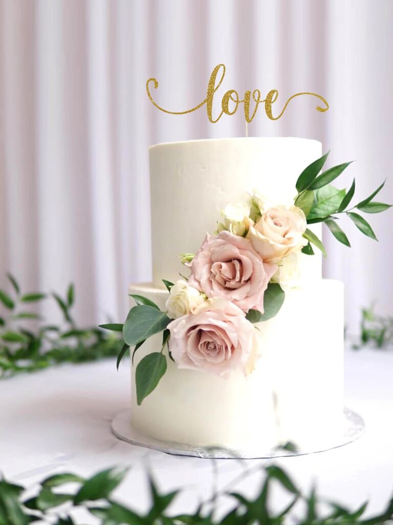 A cursive "love" cake topper.