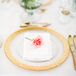 Gold-rimmed dinnerware and brass cutlery radiated in the candlelight, casting a warm, ambient glow over the sleek, modern loft space. A single pink rose was placed on each plate, helping bring the couple’s romantic vision to life.