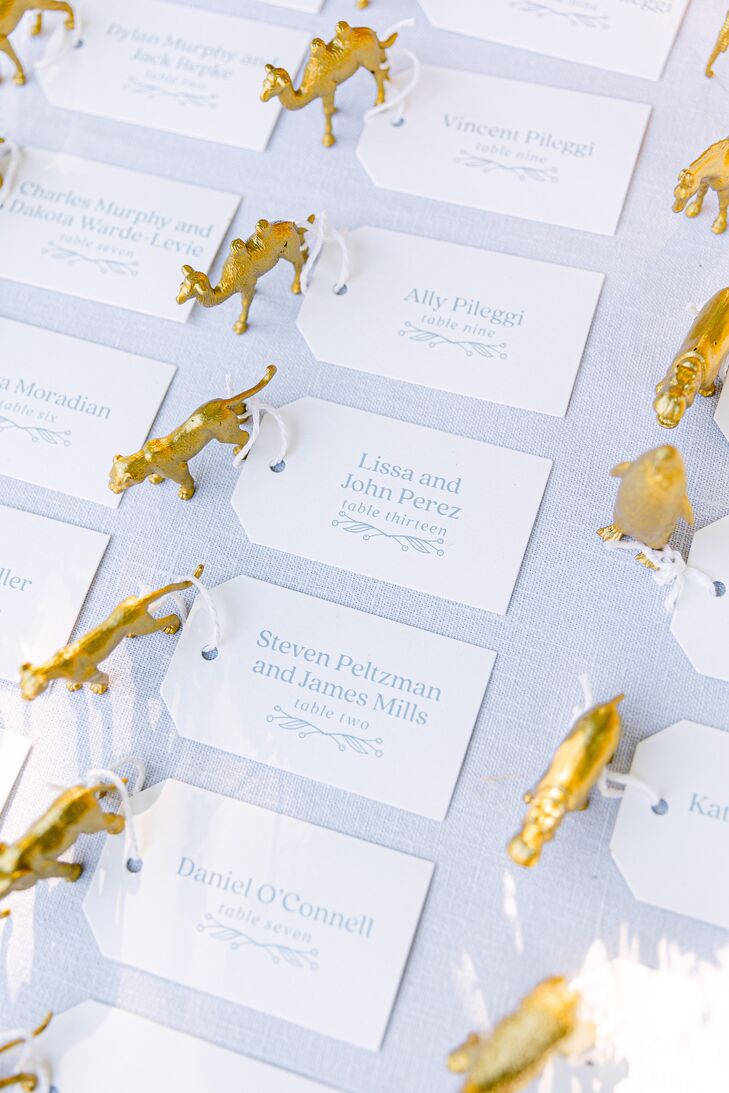 Escort Cards With Gold Animal Figurines at Central Park Zoo Reception