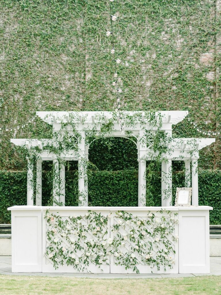 White greenery outside bar service for wedding reception