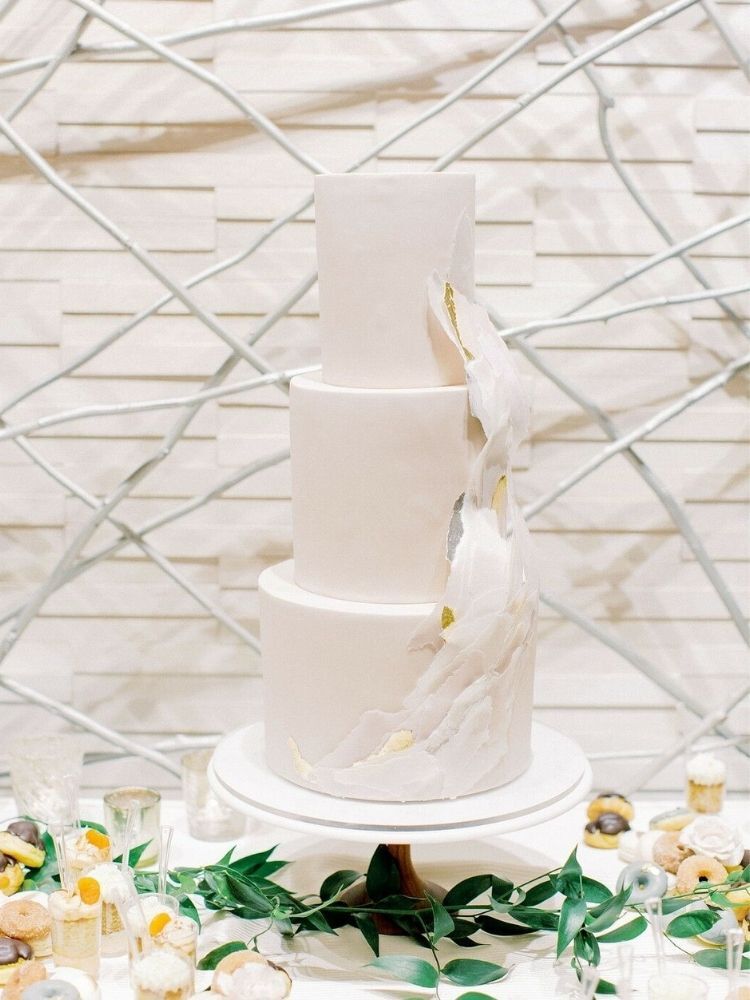 modern wedding cake with torn paper decoration