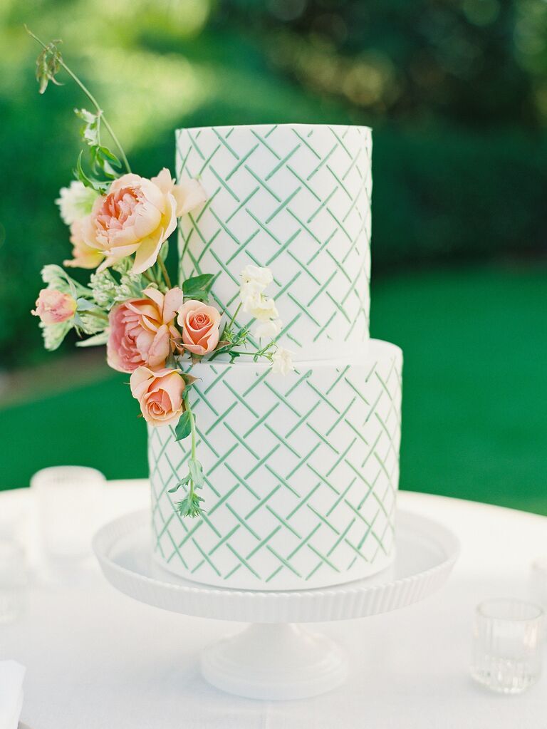 two tier wedding cake with green lattice painted design 