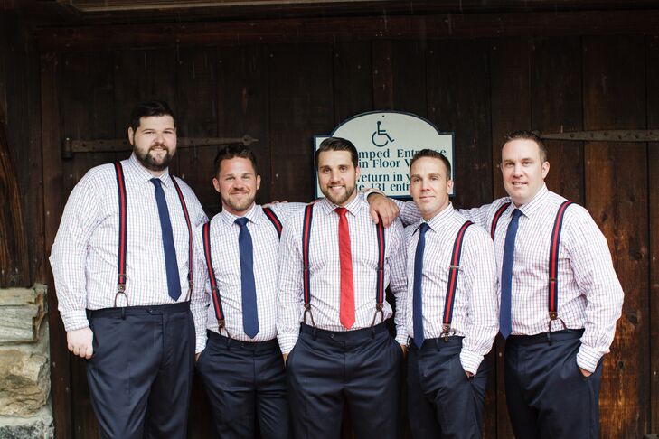 Evan and his groomsmen wanted their fashion choices to go along with the red, white and blue palette. They chose navy fitted suits with red- and blue-checkered shirts. The groomsmen wore blue ties, and Evan's was red.