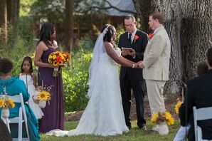 Bride and Groom Hold Hands During Ceremony
