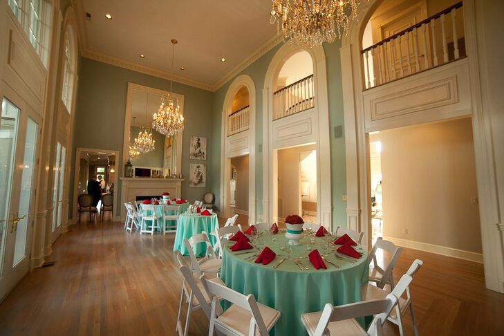 The bride's bright light blue and crimson color palette was highlighted in the reception decor.