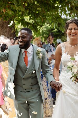 Groom in Light Teal Suit, Orange Tie and Bride in Illusion Gown Recessional