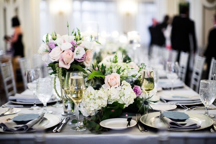 “I knew I wanted an interesting blend of flowers and textures and a growing-out-of-the-table feeling,” Rachel says. A mix of roses, hydrangeas and greenery in pinks, purples and whites were used to create whimsical floral arrangements.
