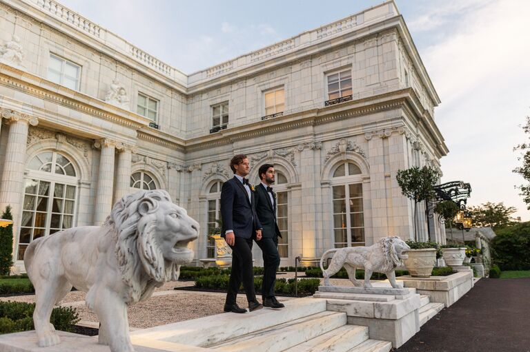 Whitaker Irvin and Michael Mendieta posing outside Rosecliff Mansion in Newport