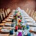 Rectangular Dining Table with Candles and Colorful Centerpieces