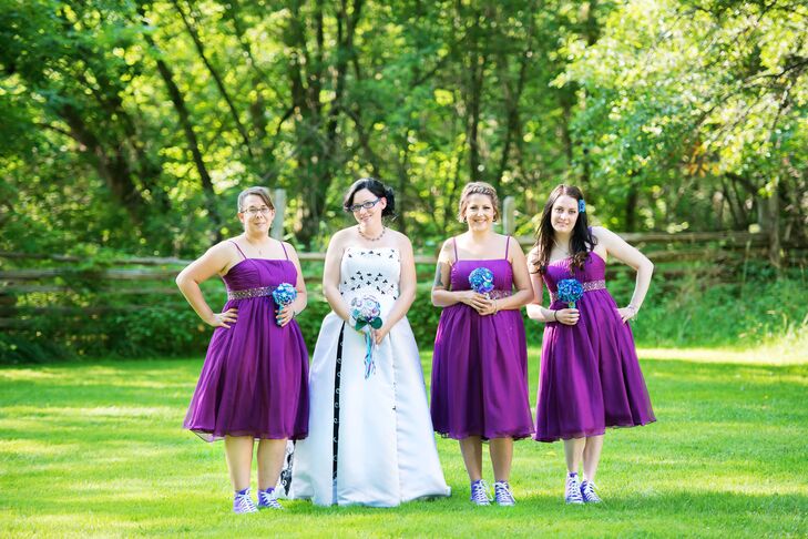 The bridesmaids wore tea length purple bridesmaid dresses paired with purple Converse high tops!