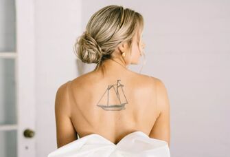 Picture of bride in backless dress with spray tan