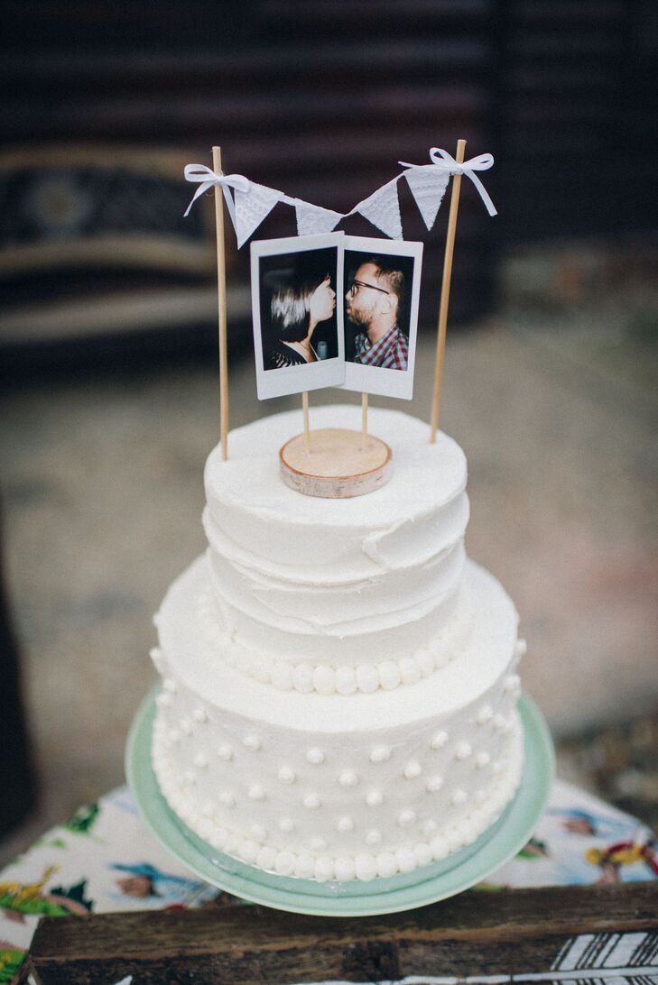 Namia and Jared had a vintage-inspired cake with the same polka-dot motif as Namia's dress. The topper was a pair of Polaroid pictures of Namia and Jared surrounded by mini pennant flags.